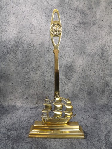 Antique brass door stop.