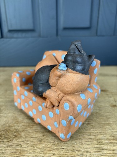 Quirky pottery pig relaxing - quirky,