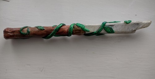 Carved wand knife with - with, leaves