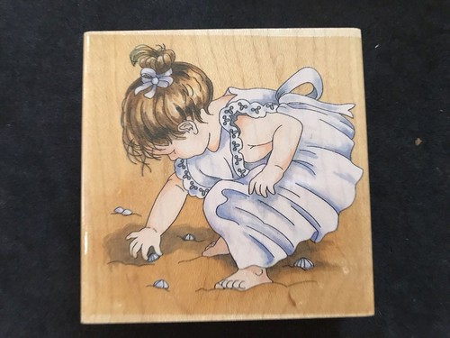 Collecting sea shells girl