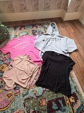 bundle of women’s clothes in