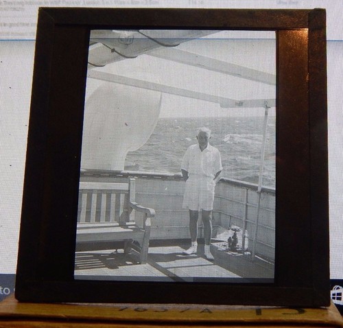 Antique glass slide merchant - glass,
