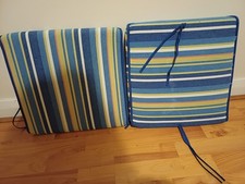 Two pairs of multicolocushioned  garden chair covers