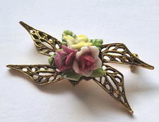 Vintage gold tone bow brooch with porcelain flowers