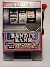 RETRO VINTAGE BANDIT BANK JACKPOT ONE ARM SLOT MACHINE COIN BANK..6" TALL 