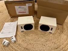 Neat Iota Speakers with wall