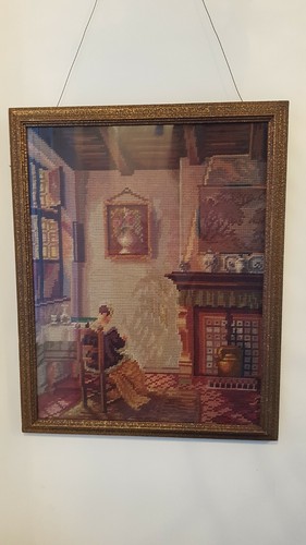 Antique tapestry framed behind
