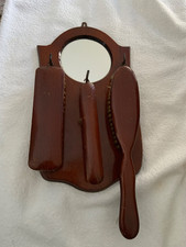 Vintage antique wooden Hall 3 clothes brush set with a round mirror.