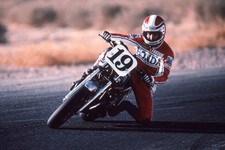Motorcycle racing star Freddie Spencer guides bike through a turn - Old Photo