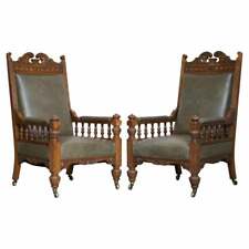 ANTIQUE PAIR OF ORNATELY CARVED OAK FRAMED LEATHER VICTORIAN THRONE ARMCHAIRS