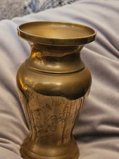 A pair of decorative brass vases, 5cms in height. Unbranded.