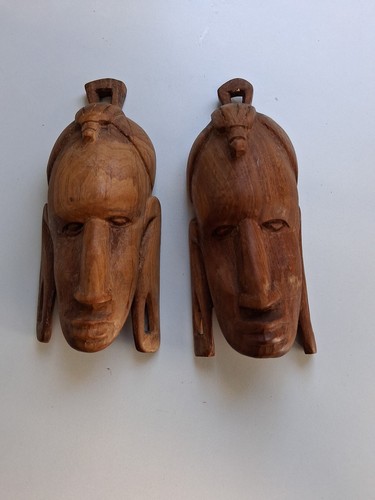 Wooden carved faces - carved, faces.