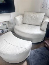 Lovely Leather Cuddle Swivel chair with matching Foot Stool