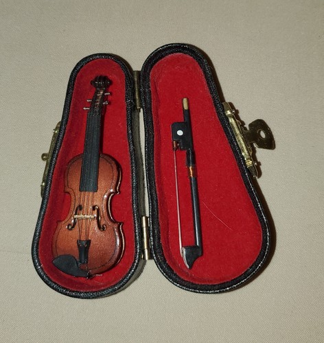 Tiny violin with - tiny, bow