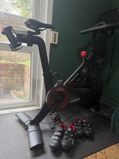 peloton bike and accessories (including mat, toe cages +weights) Shoes optional