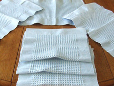Set of 6 Blue Woven Place Mats with a Waffle Design.