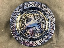 GOOD ANTIQUE BLUE LUSTRE MYTHICAL BEAT POTTERY PLATE IN THE MANNER OF DE MORGAN