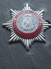 OBSOLETE MERTHYR TIDFIL FIRE BRIGADE  CAP BADGE.