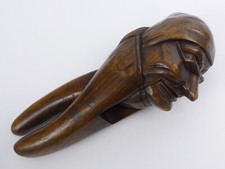 A PAIR OF ANTIQUE BLACK FOREST CARVED WOOD OLD MAN NUTCRACKERS