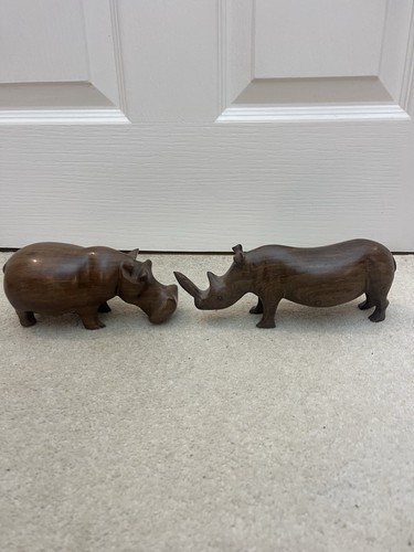 Hand carved wooden rhino - hand,