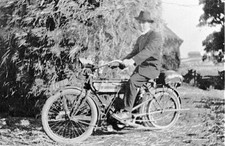 Man on a Motorbike in Front of