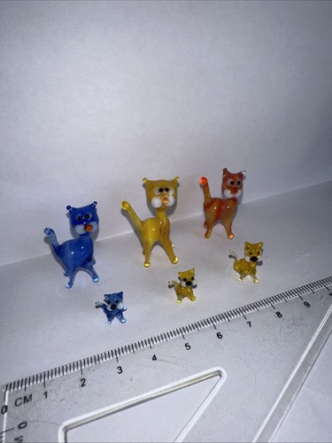 Family tiny glass cats - of,
