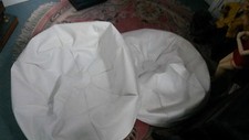 A Large White Leather look alike Football style bean bag 