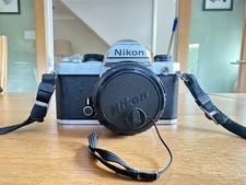 Nikon FM 35mm manual SLR Film Camera with 50mm lens, filter, case & instructions