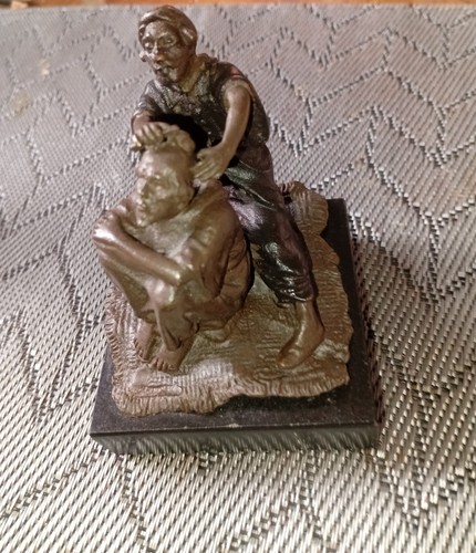 Bergman bronze arab having his - having,