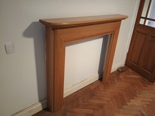 Oak fire surround in excellent condition. 137cm wide x 117cm tall.