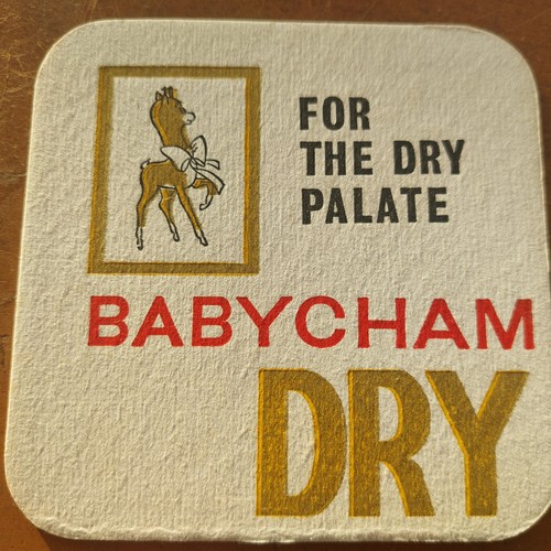 Babycham beer mat showerings - beer,