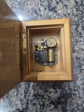 Vintage music box featuring a mechanical musical movement