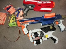 2 Nerf Guns Plus 2 other Guns/ Various Foam Bullets/glasses/mega