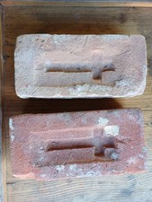 Two antique Saint bricks from