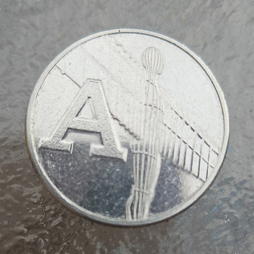 British 10p coin - british,
