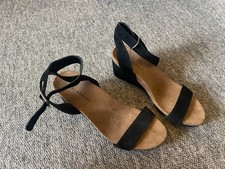 Peacocks black strap heeled