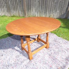 Jaycee Oval Oak Swivel Twist Top Drop Leaf Occasional Side Table