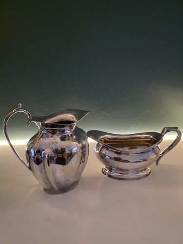 Two milk jugs silver - two, plated.