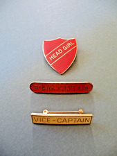 Vintage enamel school badges