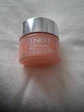 PRE-OWNED Clinique Moisture Surge SPF25 Sheer Hydrator 30ml. * Aprx HALF FULL* 