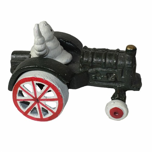 Michelin man waving tractor - in,