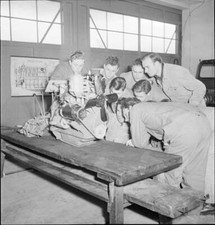 Recruits studying engine of