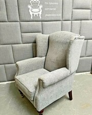 Wingback chair covered in grey