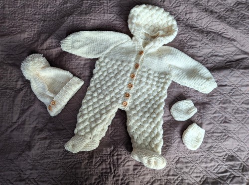 Hand knitted baby - hand,