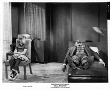 Bill Mumy looking at man lying