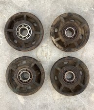 4 cast iron trolley wheels.