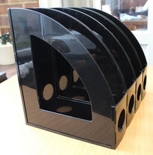 Four Black Plastic Magazine File Holders in Good Condition.
