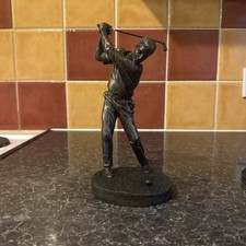 A  Bronzed Figure Of Golfer In