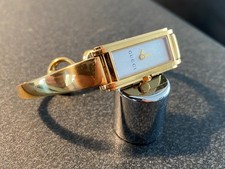 Ladies Gucci watch, 109 Mother of Pearl face, 18k Gold Bangle.