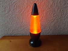 BATTERY OPERATED COLOUR CHANGING LAMP WITH FLOATING WHITE FLAKES.